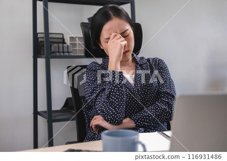 Businesswoman is thinking and is stressed about work. 116931486