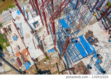 Dual Asian Welder and blacksmith work on the height scaffolding, Shoot from above of them. 116932026