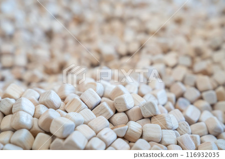 A plenty of small wooden cubes are full filled in a kid playground area for the child's background. A plenty of small wooden cubes are full filled in a kid playground area for the child's background. 116932035