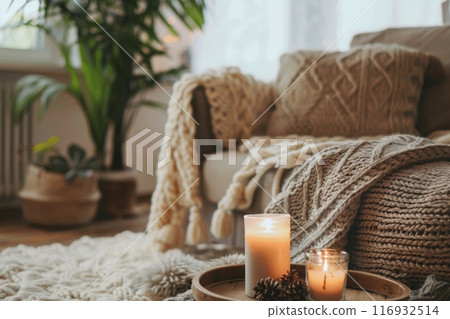 Cozy living room area with candles and indoor plants in natural light. Hygge concept. Generative AI 116932514