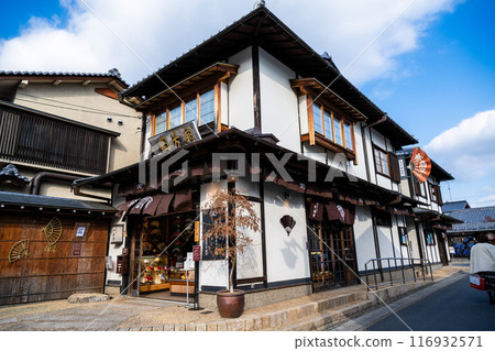 Kyoto, Japan - January 8, 2024: Shops and street view of Arashiyama Street, a popular destination. Kyoto, Japan - January 8, 2024: Shops and street view of Arashiyama Street, a popular destination. 116932571