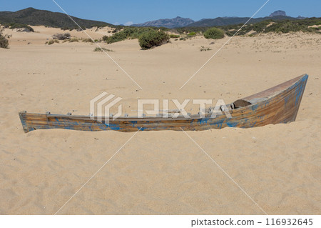 Worn Wooden Boat on Sandy Beach. 116932645