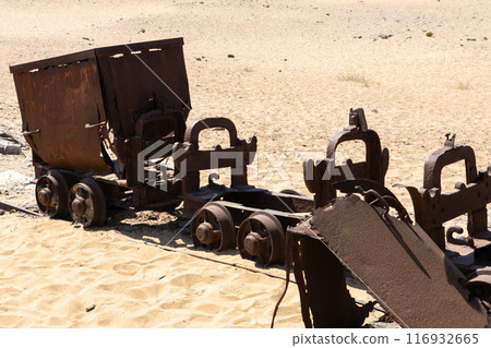 Abandoned Mining Carts in Deserted Landscape 116932665