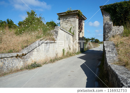 The entrance door and wheel of the Fortress at  Aix island in atlantic ocean The entrance door and wheel of the Fortress at  Aix island in atlantic ocean 116932733