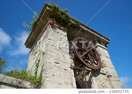 The entrance door and wheel of the Fortress at  Aix island in atlantic ocean The entrance door and wheel of the Fortress at  Aix island in atlantic ocean 116932735