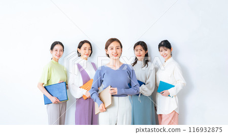 A group of middle-aged women wearing colorful office casual clothes 116932875