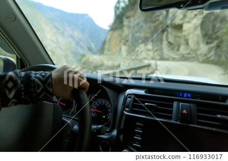Driving off road car in the canyon road 116933017