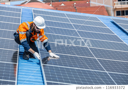 Professional Engineer Service Solar Panel. Worker Maintenance Cleaning Replacing Solar Panel. Solar photovoltaic panel system in Industry roof. Saving Energy with Clean Power. 116933372