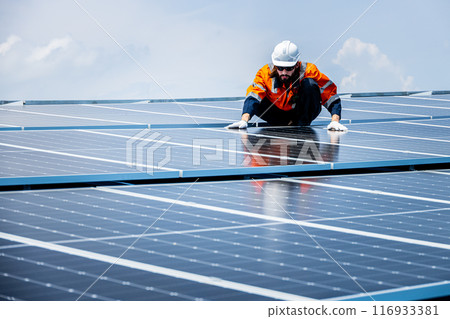 Professional Engineer Service Solar Panel. Worker Maintenance Cleaning Replacing Solar Panel. Solar photovoltaic panel system in Industry roof. Saving Energy with Clean Power. 116933381