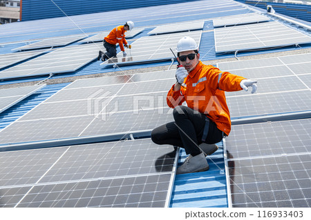 Professional Engineer Service Solar Panel. Worker Maintenance Cleaning Replacing Solar Panel. Solar photovoltaic panel system in Industry roof. Saving Energy with Clean Power. Professional Engineer Service Solar Panel. Worker Maintenance Cleaning Replacing Solar Panel. Solar photovoltaic panel system in Industry roof. Saving Energy with Clean Power. 116933403