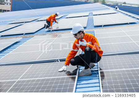 Professional Engineer Service Solar Panel. Worker Maintenance Cleaning Replacing Solar Panel. Solar photovoltaic panel system in Industry roof. Saving Energy with Clean Power. Professional Engineer Service Solar Panel. Worker Maintenance Cleaning Replacing Solar Panel. Solar photovoltaic panel system in Industry roof. Saving Energy with Clean Power. 116933405