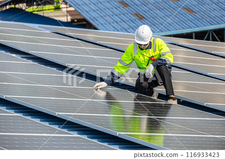 Professional Engineer Service Solar Panel. Worker Maintenance Cleaning Replacing Solar Panel. Solar photovoltaic panel system in Industry roof. Saving Energy with Clean Power. Professional Engineer Service Solar Panel. Worker Maintenance Cleaning Replacing Solar Panel. Solar photovoltaic panel system in Industry roof. Saving Energy with Clean Power. 116933423