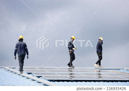 Professional Engineer Service Solar Panel. Worker Maintenance Cleaning Replacing Solar Panel. Solar photovoltaic panel system in Industry roof. Saving Energy with Clean Power. 116933426