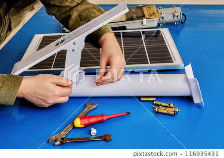 Set for install solar panel and an LED light on mounting bracket, buyer assembles an autonomous street lighting. 116935431