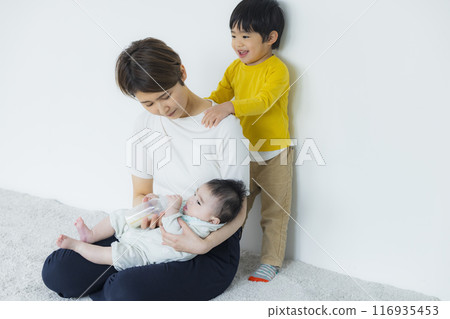 A mother playing with her children A mother playing with her children 116935453