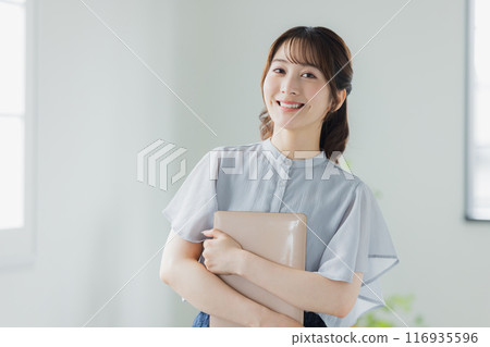 Young woman using a personal computer 116935596