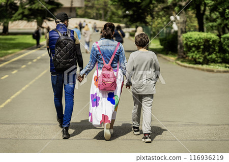 Happy family, son with loving parents in park, lifestyle concept 116936219