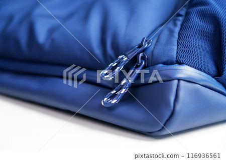 Striped zipper fasteners of a blue travel bag close up Striped zipper fasteners of a blue travel bag close up 116936561