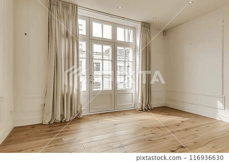 Interior of empty living room with large bright window and curtains by closed door in modern apartment with white walls and hardwood floor 116936630