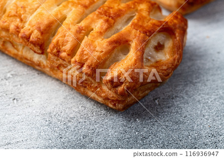 Golden Puff pastry stuffed with sausage and cheese 116936947