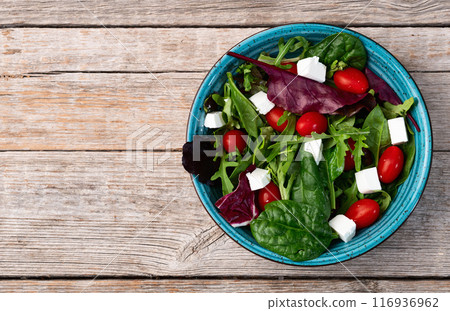 Summer salad with arugula, spinach, cherry tomatoes and cheese feta Summer salad with arugula, spinach, cherry tomatoes and cheese feta 116936962
