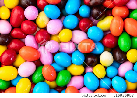 Mix of colorful candies . Multicolored unhealthy background. Sweet dessert Mix of colorful candies . Multicolored unhealthy background. Sweet dessert 116936998