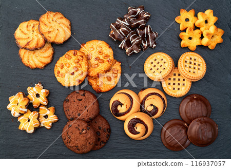 Mix of cookies . Many unhealthy snacks . Top view 116937057