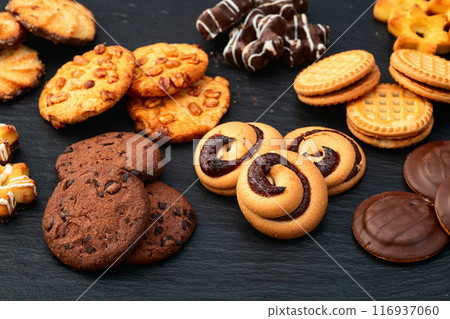 Mix of cookies . Many unhealthy snacks . Top view 116937060