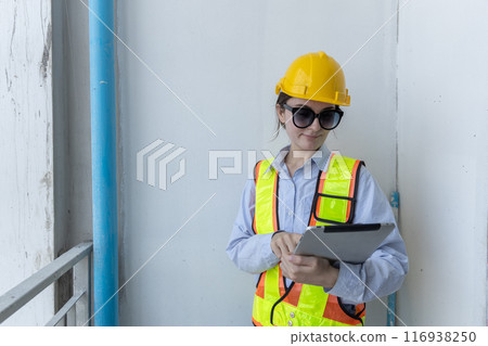 Construction civil engineer woman using tablet checking quality water pipes 116938250