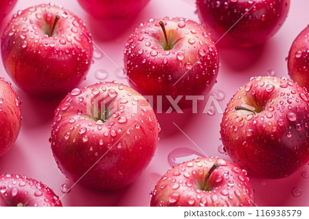 Close-up view of a group of red apples that have been freshly washed and are now glistening with water droplets. 116938579