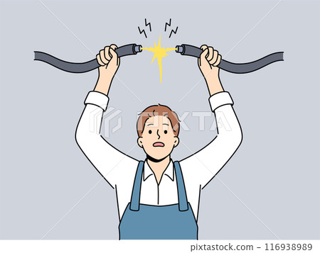 Man electrician connects high-voltage wire to electrify building, risking electric shock 116938989