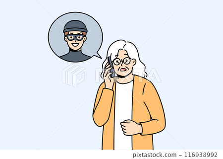 Elderly woman is talking to telephone scammer who is trying to find out bank account password 116938992