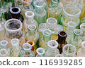 Big group of small empty glass bottles, aged and dusty 116939285