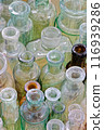 Big group of small empty glass bottles, aged and dusty 116939286