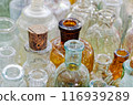 Big group of small empty glass bottles, aged and dusty 116939289