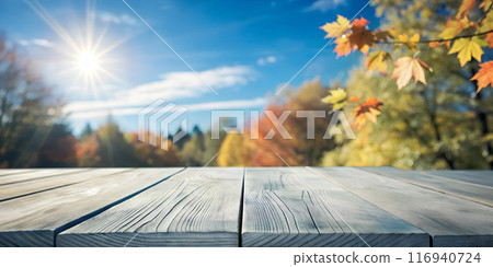 Wooden tabletop for promotional items at sunset and bright sunny day. 116940724