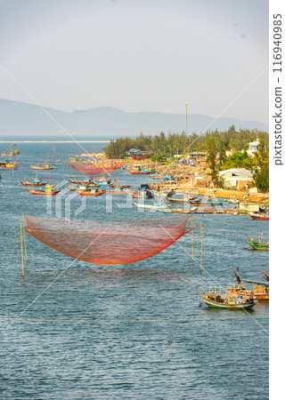 Fishing nets on the river, in Cua Dai fishing village. Fishing nets on the river, in Cua Dai fishing village. 116940985