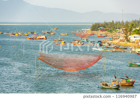 Fishing nets on the river, in Cua Dai fishing village. Fishing nets on the river, in Cua Dai fishing village. 116940987