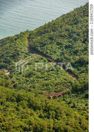 Hai Van pass - the famous road which leads along the coastline mountains near Da Nang city, Vietnam. 116941709