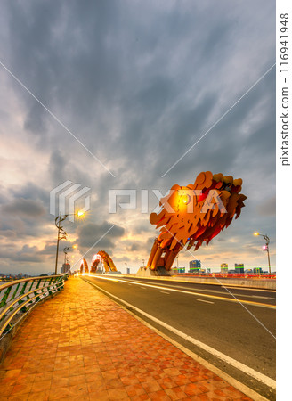 Dragon bridge in Danang at sunset which is a very famous destination for tourists 116941948