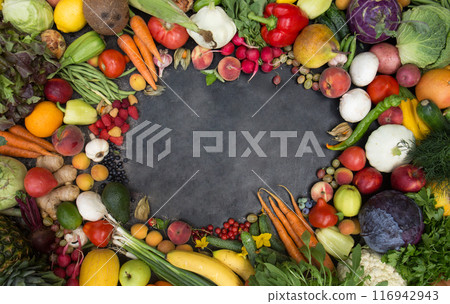A frame of various vegetables, fruits and berries. Concept of fertility and good harvest, top view 116942943
