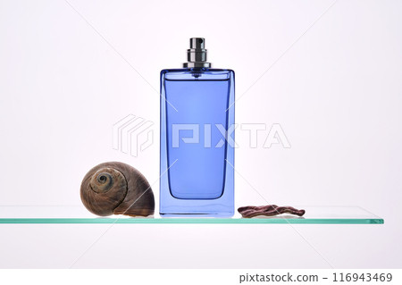 Perfume spray in a blue bottle on a white background. 116943469