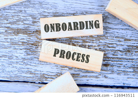 Onboarding Business Process New Employee Welcome Concept. Onboarding worker management. ONBOARDING PROCESS on wooden blocks, a conceptual phrase against the background of old boards Onboarding Business Process New Employee Welcome Concept. Onboarding worker management. ONBOARDING PROCESS on wooden blocks, a conceptual phrase against the background of old boards 116943511