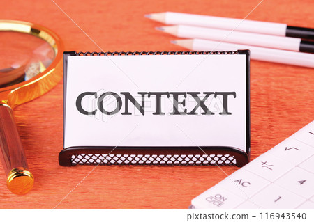 Conceptual context symbol. Copy space. Context word written on a white business card on an orange background Conceptual context symbol. Copy space. Context word written on a white business card on an orange background 116943540