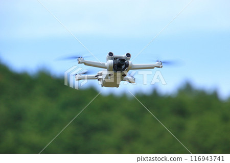 Drone 6 A drone flying against a green background 116943741