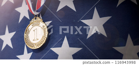 Gold silver and bronze mockup trophy medals with ribbon against United States of America flag. Represent winner of national or international olympic sport competition. Award winner and victory concept 116943998