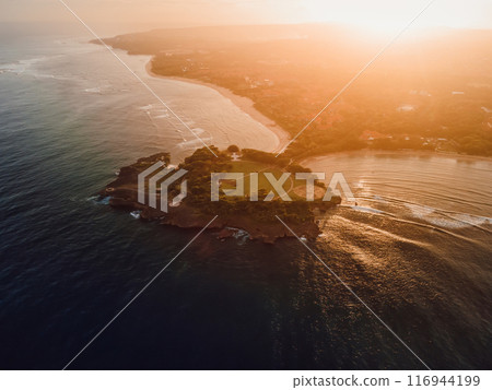 Ocean coastline with islands, warm sunset tones in Nusa Dua area, Bali Ocean coastline with islands, warm sunset tones in Nusa Dua area, Bali 116944199