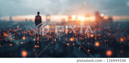 Person Looking Out Over Cityscape at Sunset 116944506