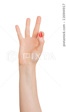 Hand displaying the number 9 with fingers, isolated on a white background. Elegant womans hand with 116944917
