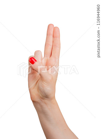 Two fingers raised, reminiscent of a gun gesture, isolated on white background. Elegant and delicate 116944960
